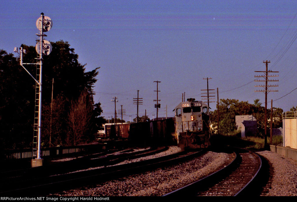 SBD 8327 holds at the southbound signal for a train